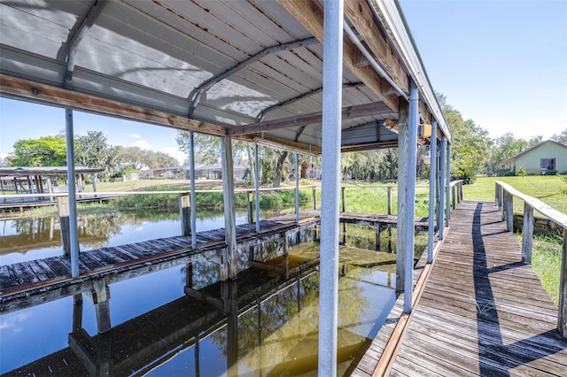 dock area with a water view