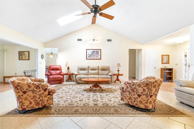 tiled living area featuring visible vents, vaulted ceiling, and ceiling fan