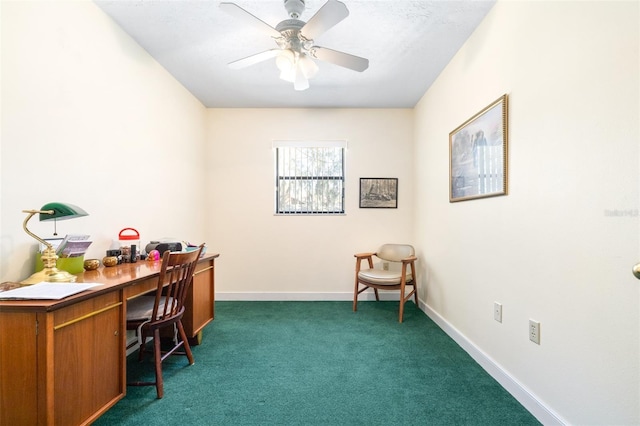 home office featuring baseboards, dark colored carpet, and a ceiling fan