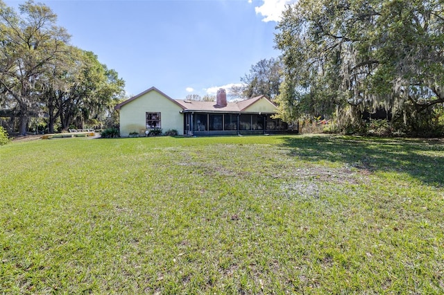 view of yard featuring a sunroom