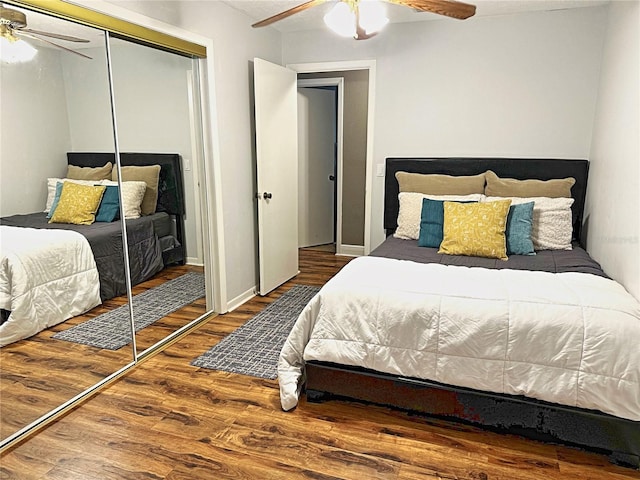 bedroom with ceiling fan, hardwood / wood-style floors, and a closet