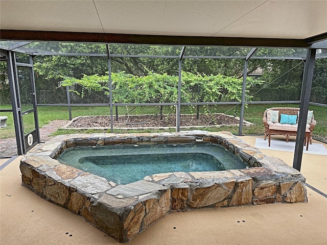 view of pool with a lanai and a patio