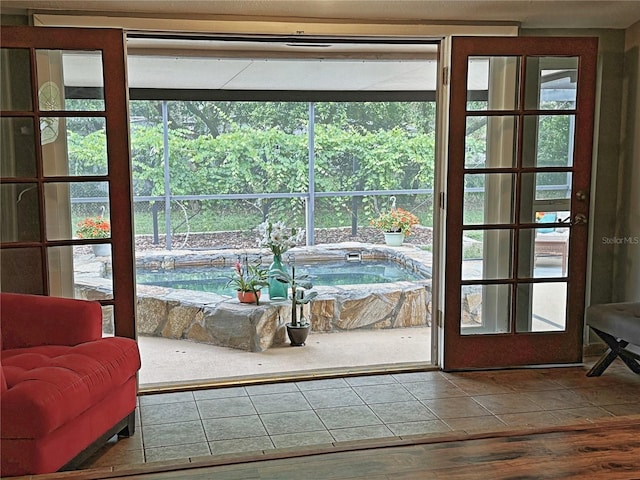 doorway featuring a wealth of natural light and hardwood / wood-style flooring