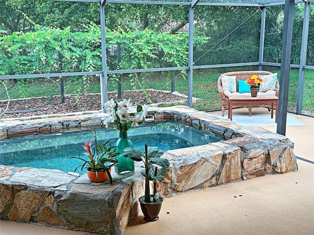 view of pool featuring a hot tub and a patio