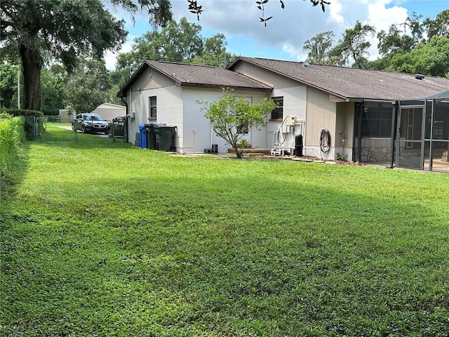 rear view of property with a yard