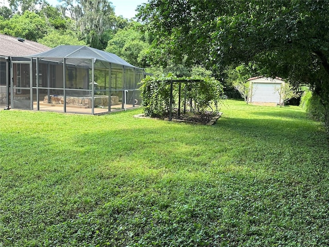 view of yard with a lanai