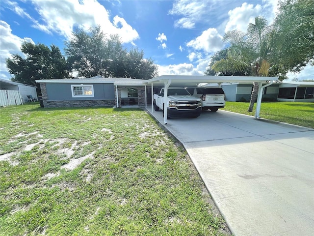 view of front of property with a carport and a front yard