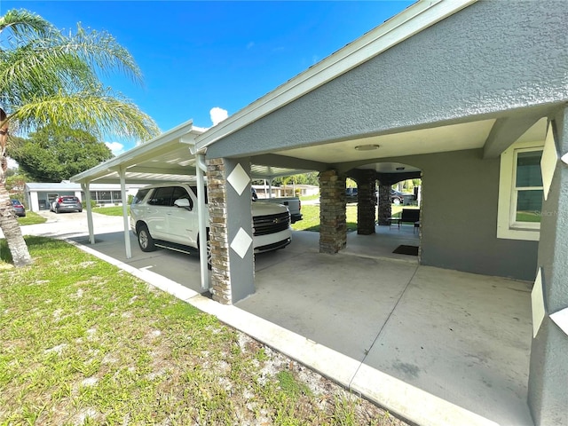 view of vehicle parking featuring a yard