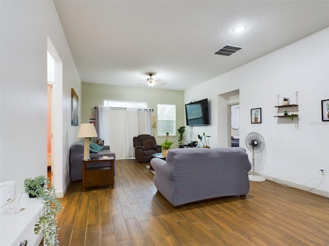 living room with dark hardwood / wood-style floors