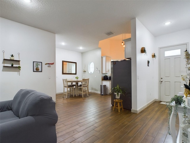 living room with dark wood-type flooring