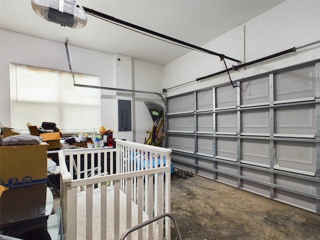 garage featuring electric panel and a garage door opener