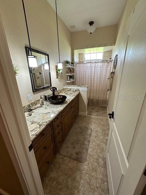 bathroom featuring tile patterned floors and vanity