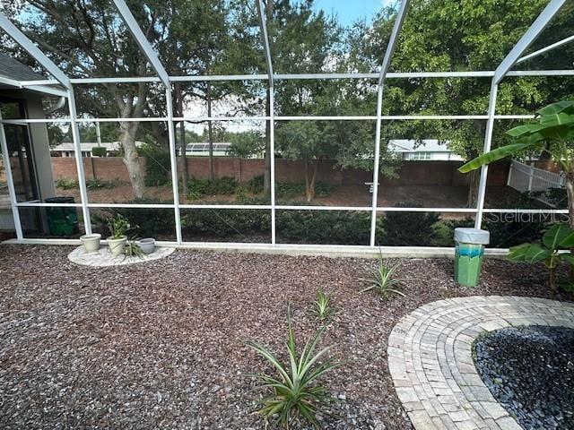 view of yard featuring glass enclosure