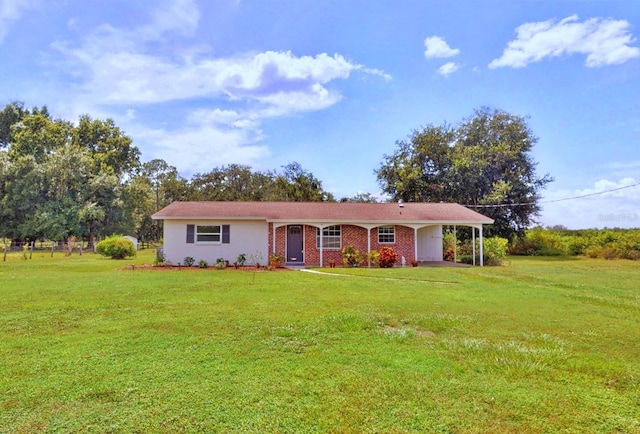 single story home featuring an attached carport and a front yard