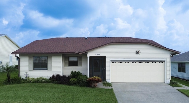 single story home with a garage and a front yard