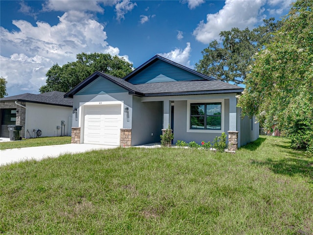 view of front of house featuring a front yard and a garage