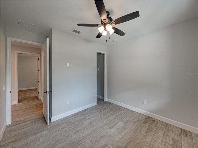 unfurnished bedroom with ceiling fan and light hardwood / wood-style floors