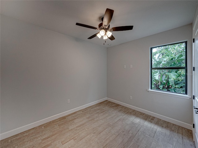 empty room featuring ceiling fan and light hardwood / wood-style floors