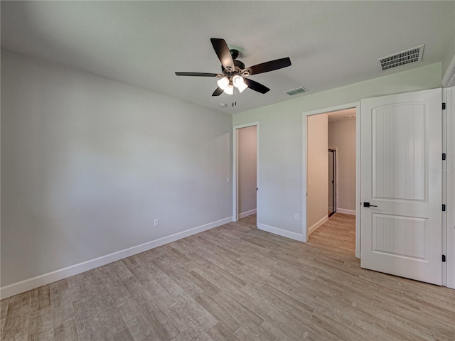 unfurnished bedroom with ceiling fan and light hardwood / wood-style flooring