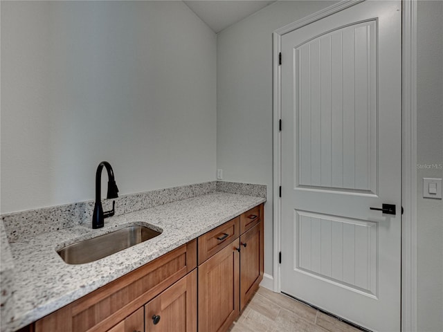 bathroom with hardwood / wood-style flooring and sink