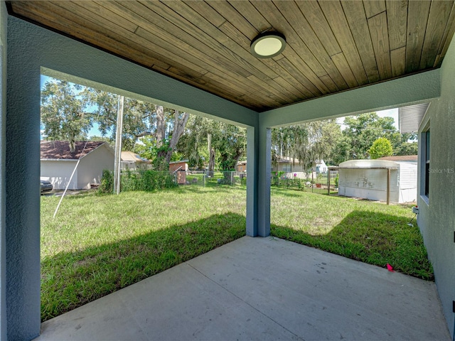 view of patio / terrace featuring a storage shed