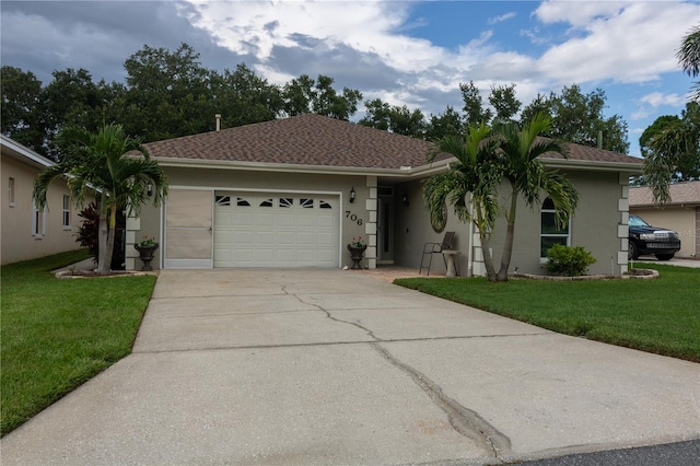 ranch-style home featuring a garage and a front lawn