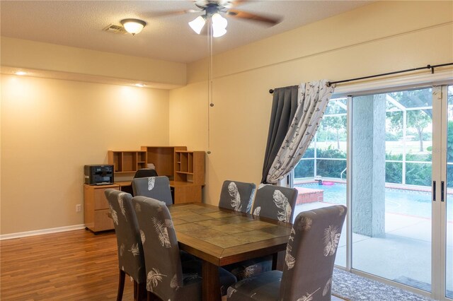 dining area featuring ceiling fan and hardwood / wood-style floors