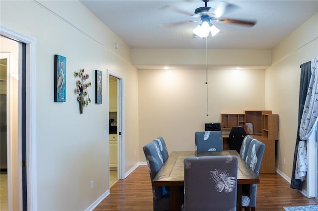 dining space featuring ceiling fan, a textured ceiling, and hardwood / wood-style flooring