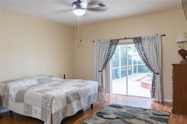 bedroom featuring ceiling fan, access to outside, and hardwood / wood-style flooring