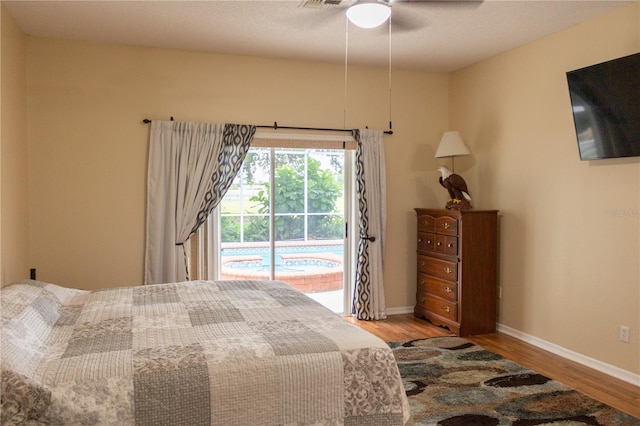 bedroom with ceiling fan, access to outside, and light hardwood / wood-style flooring