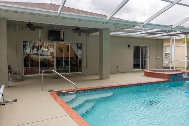 view of swimming pool featuring ceiling fan and glass enclosure