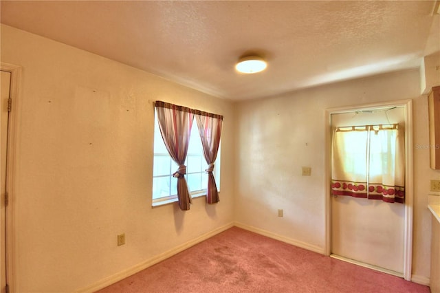 317 C St, Lake Wales, FL 33853 - carpeted empty room featuring baseboards and a textured ceiling