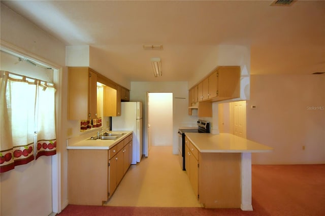 kitchen featuring black range with electric cooktop, light brown cabinetry, white fridge, sink, and light colored carpet