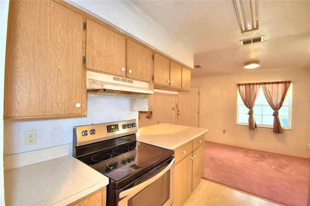 kitchen featuring stainless steel range with electric stovetop and light colored carpet