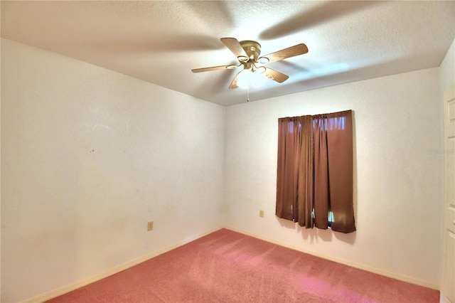 unfurnished room with ceiling fan, a textured ceiling, and carpet flooring