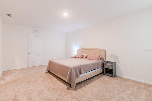 bedroom featuring light colored carpet