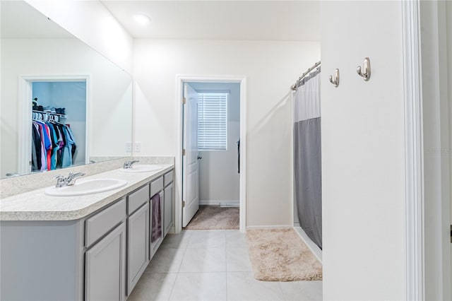 bathroom featuring dual vanity and tile patterned floors