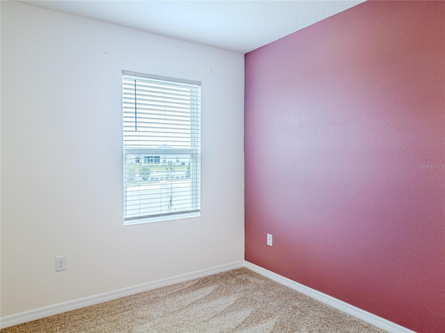 spare room with light colored carpet