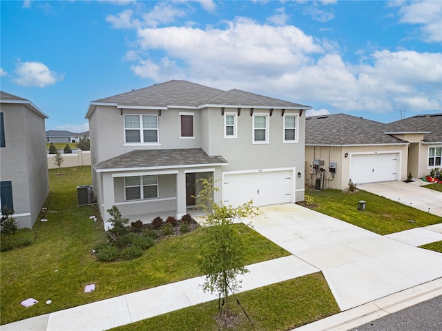 view of front of house featuring a garage, central AC, and a front lawn