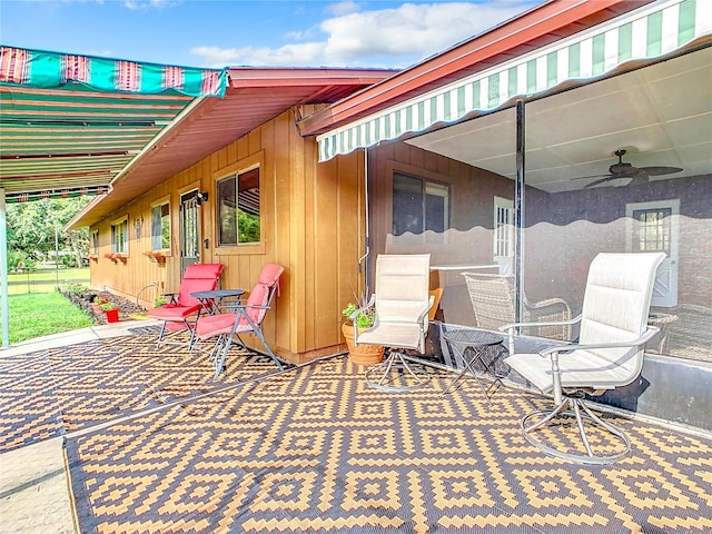 view of patio / terrace featuring ceiling fan