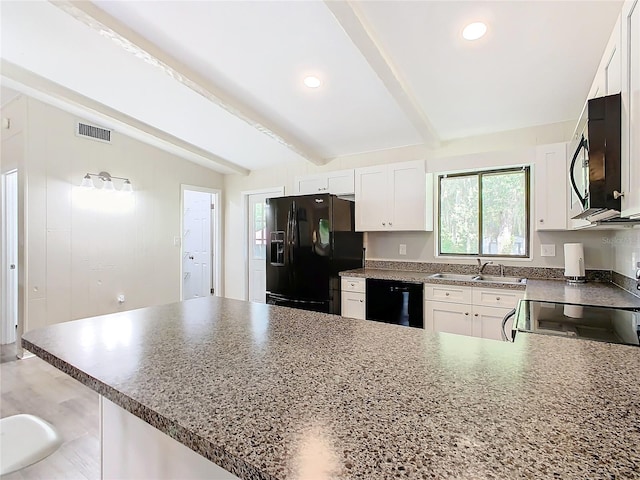 kitchen with black appliances, a sink, visible vents, and white cabinets