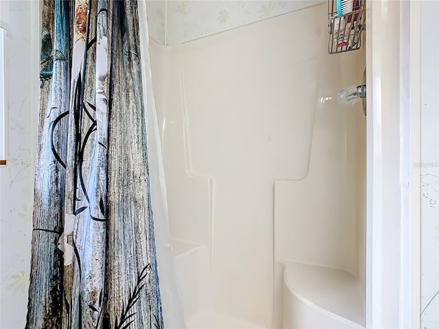 full bath with a shower with curtain