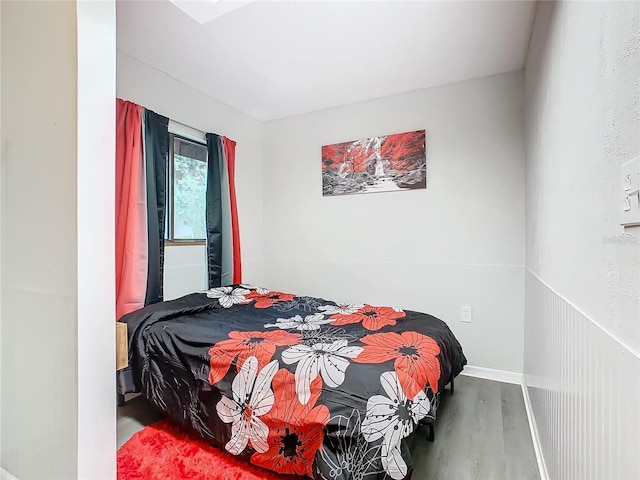 bedroom with wood finished floors