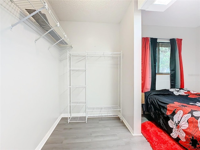 spacious closet with wood finished floors