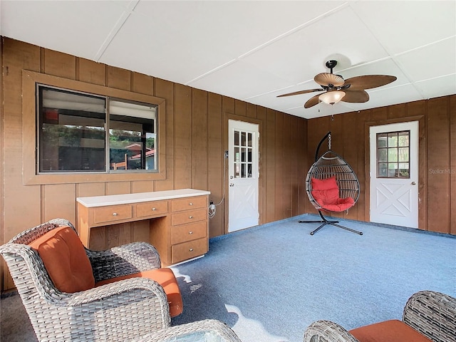 sitting room with ceiling fan and carpet floors