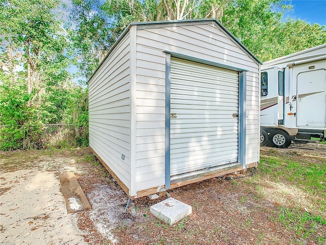 view of shed with fence