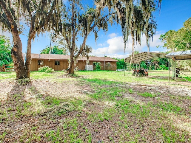 view of yard featuring a detached carport