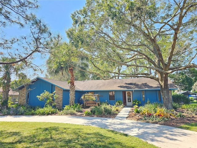 ranch-style home with a front yard