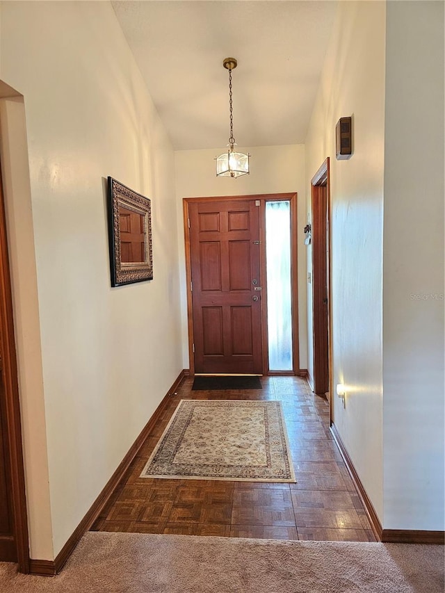 view of carpeted entrance foyer