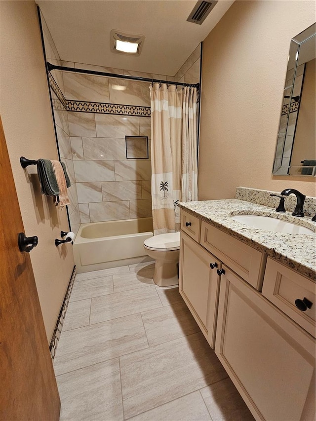 full bathroom with vanity, toilet, and shower / bath combo with shower curtain